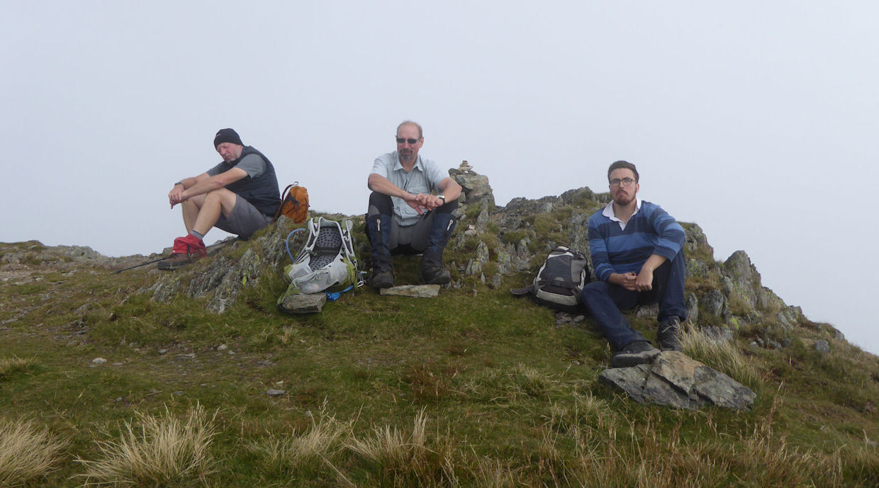 Andy, Duncan and Richard ponder the view from Place Fell. Photo by Mike Goodyer